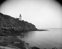 Playing on the rocks, below Souris Lighthouse