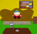 The photo behind Cartman's couch which shows Liane handing out cookies at Mount Rushmore.