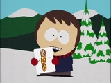 Portant une image dessinée de Monsieur Hankey dans Les Chants de Noël de Monsieur Hankey.