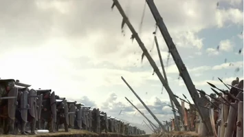 The Rebel army lifts ladders to disintegrate the Testudo