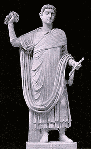 Statue of fourth century CE Magistrate throwing down mappa before chariot race starts.