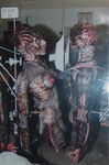 Puppet of Eve in alien form and puppet of Patrick in humanoid alien form