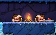 Cavemen sleeping beside a fire.