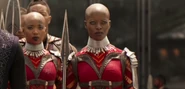 Florence Kasumba as Ayo