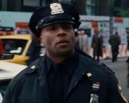 Derrick 'Phoenix' Thomas as Cop at Crane Disaster