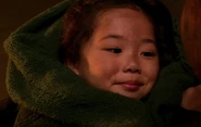 Venus Lam as Child in Burning Building