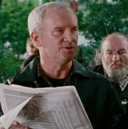 Jim Coope as Newsstand Patron