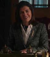 Helen Stern as British Desk Attendant