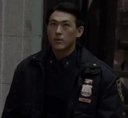 James Chen as Police Officer
