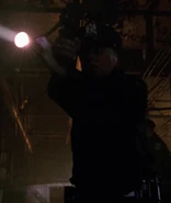 Unknown actor as Warehouse Cop #1