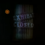 "Exhibit Closed" sign over broken screen