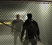 Sam talks to Jr. Wilkes in the parking garage.