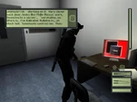 Sam Fisher hacks Mitchel Dougherty's desktop PC.