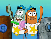 Incidental 118 and Policeman 2 happily waving to the cheering crowd.