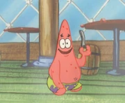 NNN Patrick1.jpg (100 kB) Patrick looking at the viewer with a fork in hand.