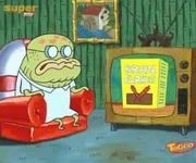 جنكيز يشاهد أعلان حول رقائق الذرة في أحدى الحلقات.