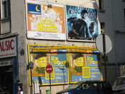 A French poster seen on the side of a building