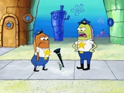 Policeman 2 and Incidental 118 about to arrest Plankton.