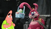 The Easter Bunny gives Patrick an egg.