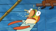Incidental 97 getting hit in the face by a Krabby Patty.