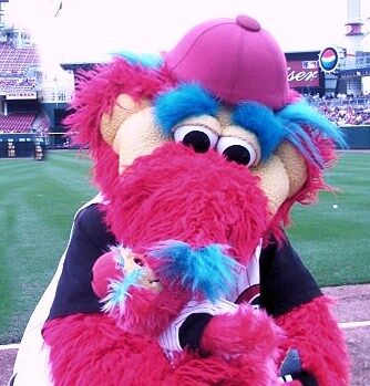 Cincinnati Reds mascot Mr. Red sits in the stands during a