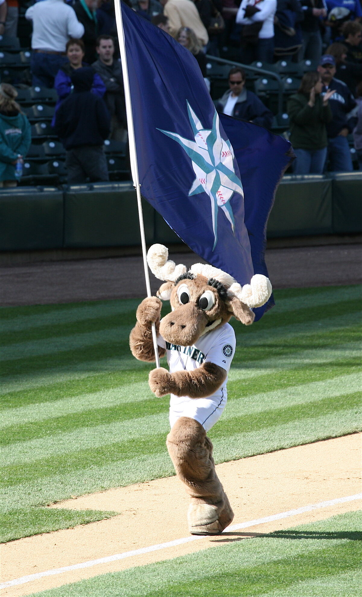 Seattle Mariners pitcher and Moose mascot stand up against