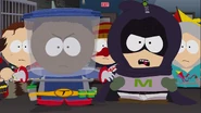 Mysterion confronting Jared alongside Tupperware after defeating him.