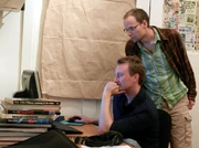 John (seated) working on SpyParty with 