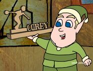 Elf holding a Corey sign