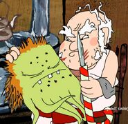 Santa Claus holding Rusty next to a candy cane knife