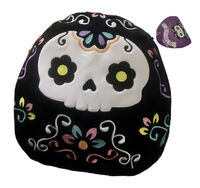 A photo of a sugar skull plushie.