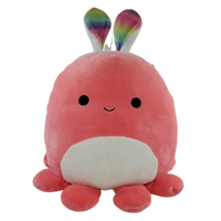 A photo of a pink octopus plush wearing white bunny ears