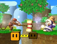 The middle part of the stage with some turning blocks triggered by the Ice Climbers and Diddy Kong, who is using a Golden Hammer.