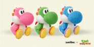 Pink, Green, and Blue Yarn Yoshi amiibo figures.