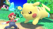 Large Pikachu running towards Mario on Tortimer Island.