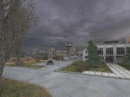 Inaccessible office entrance with walkway exit to the left.