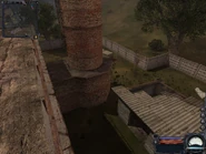 The back yard and empty building.