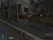 Through the gate, turn right and into the building.