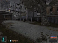 Go through the opening in the fence nearest the tree. Turn right and stay against the fence.