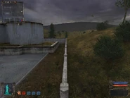 Slow walk until you can jump to the elevated part.