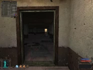 Room at the end on the left.