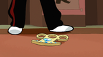 S1E5 Gold knuckles at sensei's feet