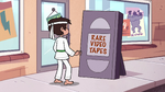 S2E4 Marco in front of Rare Video Tapes sign