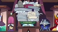 S3E29 Moon holding a large pile of evidence