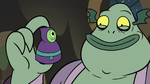 S3E5 Buff Frog holding babushka monster game piece