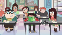 S2E32 Marco Diaz hides his face in a textbook