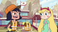 S2E38 Janna handing Star Butterfly an orange vest