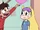S1E6 Marco points to wall of pictures.png