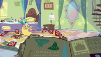 S2E25 Star Butterfly looking at her book of spells