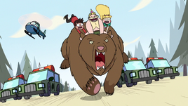 S2E10 Star, Marco, and King riding a grizzly bear